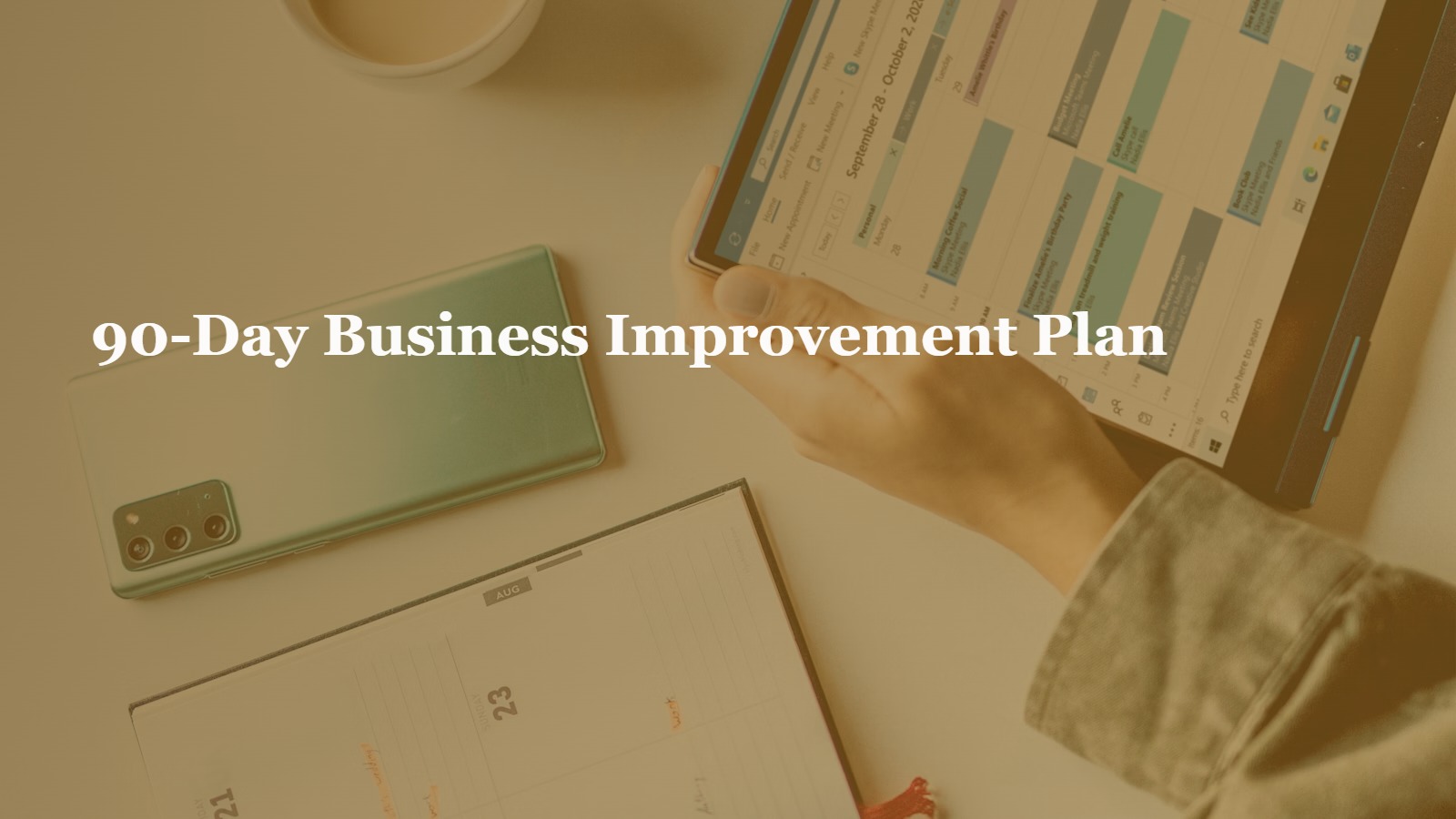 Business planner and calendar on a laptop screen representing a 90-day improvement plan
